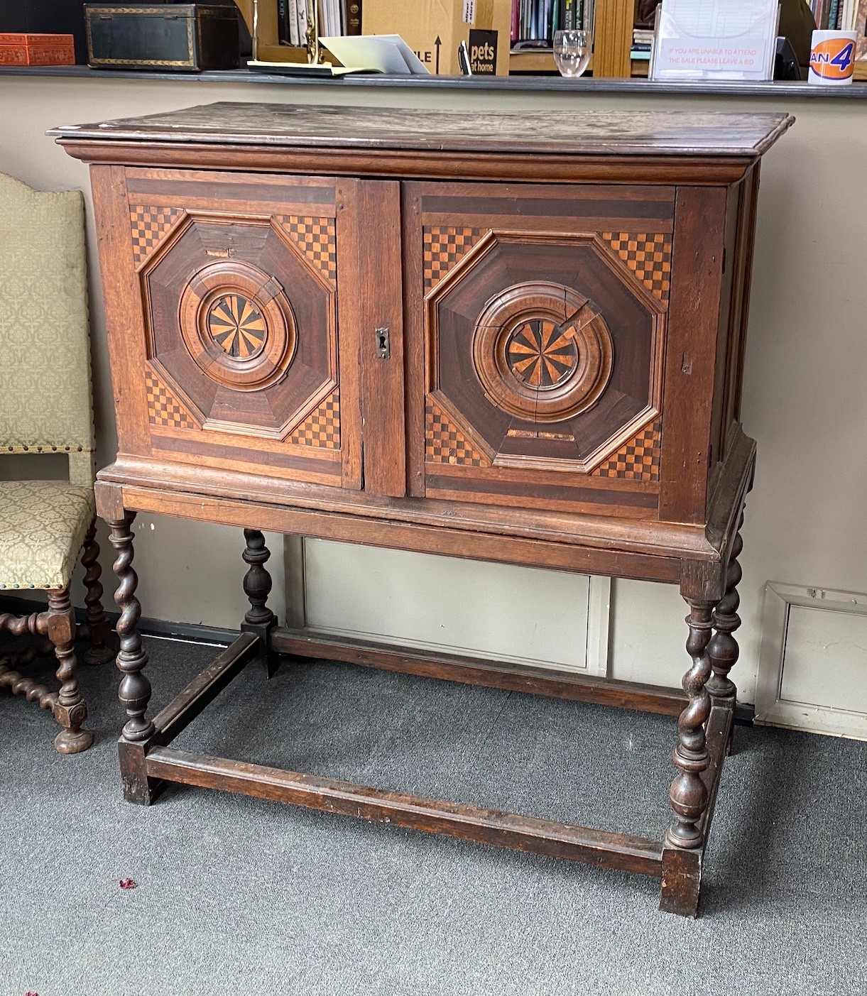 A 17th century style parquetry inlaid walnut cabinet on stand, with two doors enclosing three long drawers, width 118cm, depth 59cm, height 133cm